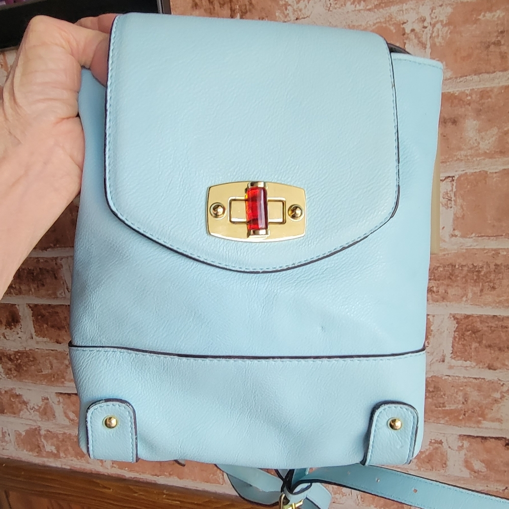 Small teal colored backpack purse.